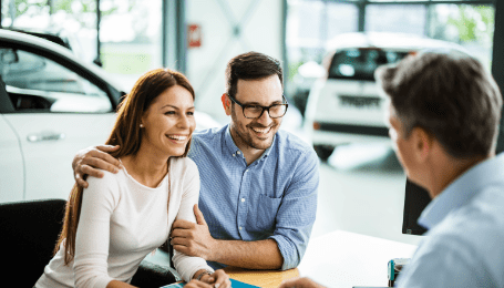 couple at auto dealership